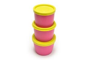 Pink tube plastic container with yellow lid white background photo