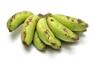 Bananas are half ripe yellowish green white background photo