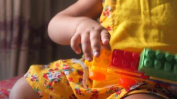 A child playing with a toy brick video