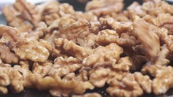 Walnuts are being cooked in a frying pan video