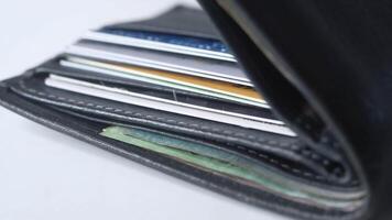 A wallet with several credit cards in it video