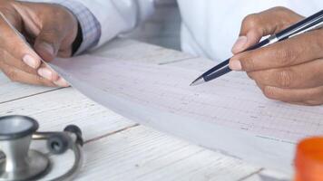 A doctor is writing on a piece of paper video