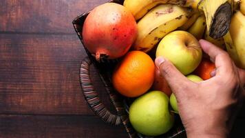 A basket of fruit on a wooden table video