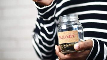 Budget jar with money in it video