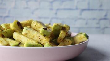 A bowl of green and yellow vegetables on a table video