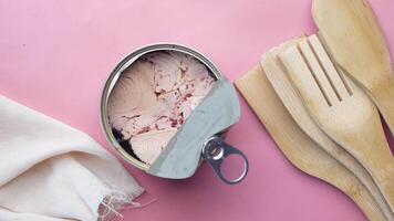 A can of tuna with a fork and spoon next to it video