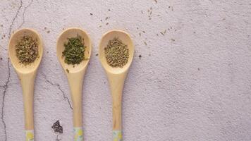 Three wooden spoons with different herbs and spices video