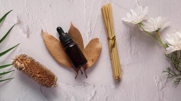 Essential oils and flowers on a white background video