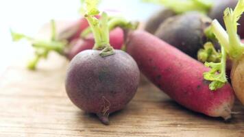 A close up of radishes on a wooden surface video