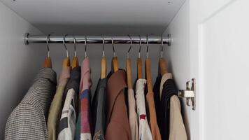 Wellorganized closet with neatly folded clothes and textiles for a tidy, minimalistic look video