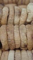 A CloseUp View of Natural Dried Fig Rolls Stacked Neatly Together, Showcasing Their Texture video