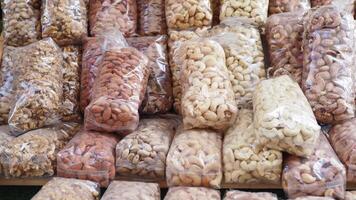 many mixed nuts in a plastic packet on shelf video