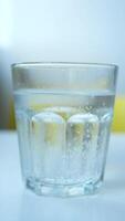 A Refreshing Glass of Sparkling Water, with Bubbles, Set Against a Clear Background video