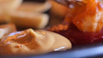 A Colorful Condiments Selection Mustard and Ketchup Served Together on a Plate for Enjoyment video