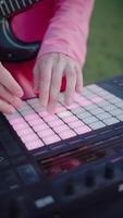 Hands Playing on MIDI Controller in Outdoor Setting video