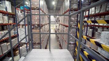 Poland, Warsaw- September 14, 2022. Span in warehouse. Creative. Constructions in stock with goods. Large warehouse with cargo. Movement through structures of warehouse with goods video