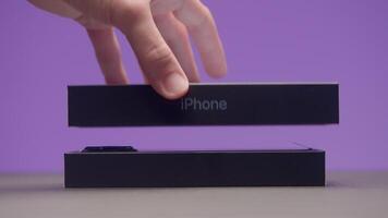 New iPhone. Action.New technology development concept with three cameras and new packaged box. Use for editorial only. video