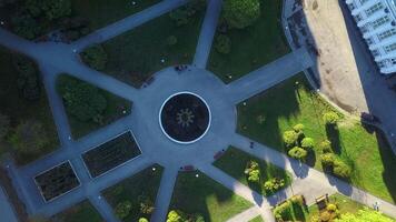 Top view of garden with fountain at manor. Clip. Pattern of paths with fountain in center of ancient chad. Old well-kept garden with fountain and manor house video