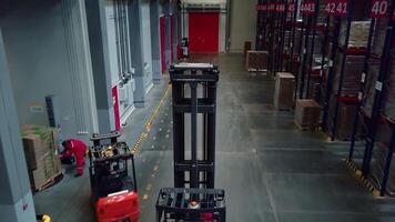 Continuous flow of work in the warehouse. Creative. Running people with goods putting them on different racks for further transportation. video