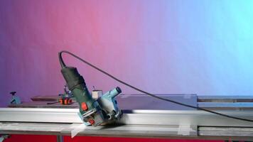 Equipment for manual cutting of metal plates. Creative. Carpentry equipment in modern workshop. New machines stand on metal cutting table in stylish workshop video