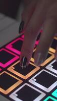 Drum machine in the night club playing live set. Stock. Fingers tapping drum pads on a digital beatmaker close-up. Dj starts playing music set in the club playing the drum machine video