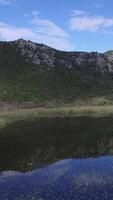 Nice view on the ocean with mountains aerial. Footage. Beautiful landscape aerial. View from helicopter at mount and sea. Beautiful sky with clouds video