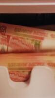 counting banknotes in the Money counting Machine. Machine for counting money with Russian money video