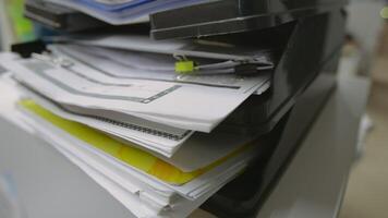 Close up of stacks of documents files in the office. Stock footage. Business report papers in a plastic folder. video