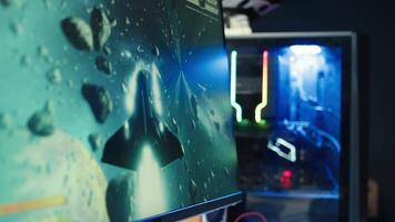 Man at home using high end computer system to play demanding science fiction videogame. Gamer enjoying high quality game, streaming it online, shooting laser beams with spaceship, camera B close up video