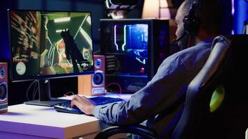 Gamer feeling annoyed after losing online multiplayer action videogame match, being outsmarted by rival players. Dejected man hitting desk after seeing game over message on computer screen, camera A video