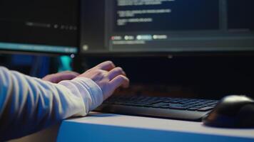 Technician doing software quality assurance, reading source code on PC before implementing it. IT admin inspecting coding on computer, looking to fix potential issues, camera B close up video