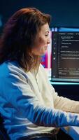Vertical Happy developer celebrating after managing to secure company servers from virus attacks. Cheerful IT employee throwing fist in air from excitement after building firewalls protecting data, camera A video
