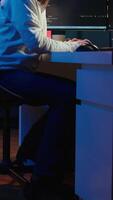 Vertical Programmer stretches body limbs after securing company servers from virus attacks all day. Fatigued IT remote employee relaxing tense muscles at desk after building firewalls protecting data, camera B video