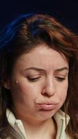 Vertical Upset teleworking engineer worried after failing to secure company servers from virus attacks, close up. Anxious woman stressed about being unable to build firewalls protecting data, camera A video