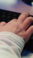 Vertical Computer technician working from home, designing and developing software applications, close up. IT specialist typing on PC keyboard, implementing and maintaining company systems, camera A video