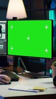 Vertical Woman using professional software on mockup PC to create visual effects for projects. Specialist using post production techniques to edit raw clips footage on green screen computer, camera A video