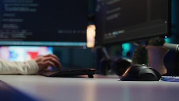 Computer technician working from home, designing and developing software applications, close up. IT specialist typing on PC keyboard, implementing and maintaining company systems, camera B video