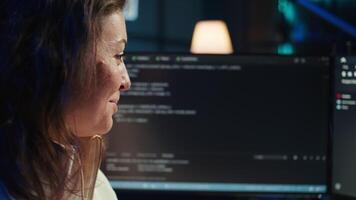 Delighted programmer celebrating after filtering malicious traffic from cybercriminals attempting to steal company data. Woman excited about accomplishment, preventing malware, camera B video