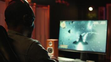 Man at home shooting asteroids in spaceship flying singleplayer game with overlay HUD showing health, fuel, ammo bars and minimap. Gamer navigating universe in simulation game, close up, camera B video