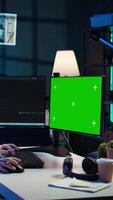 Vertical Freelancing admin using green screen computer monitors to filter malicious traffic from cybercriminals attempting to corrupt company data. IT expert in apartment working on mockup desktop PC, camera B video
