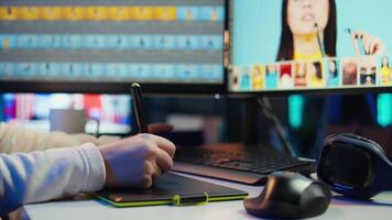 Photo editor using graphic tablet to edit color balance, delivering appealing photographs for magazines. Close up on graphic designer using stylus on touchscreen device to modify images, camera B video