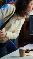 Vertical Computer scientist arriving in home office, ready to design and develop software applications. IT expert starting job shift, implementing and maintaining company systems, camera A video