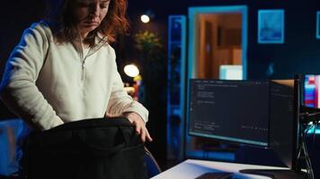 Teleworking programmer arriving in home office, ready to secure company servers from virus attacks by coding. IT employee starting job shift, building firewalls protecting data from threats, camera B video