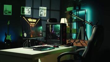 Professional gaming empty room studio with neon lights and RGB lit computer next to headphones and VR headset. Dolly in shot of FPS videogame on pc display and virtual reality goggles in apartment video