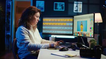 Photographer using software on computer to perform editing operations, enjoying cup of coffee while correcting images. Photo editor using PC to make adjustments to photographs in studio, camera B video