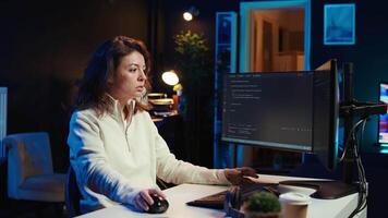 Cybersecurity specialist looking confused at computer screen while trying to fix broken code. Contemplative developer feeling worried and anxious about programming errors, camera B video