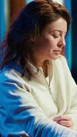 Vertical Portrait of professional editor editing color grading and lighting in creative office, analyzing film montage, close up shot. Post production videographer manipulates raw footage, camera A video
