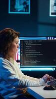 Vertical Cybersecurity expert using computer and augmented reality to look for company security vulnerabilities and injected malware. Programmer installing code on PC, looking at AR visualization, camera A video