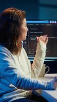 Vertical Software engineer teacher doing online tutoring, talking with student in online videocall about ways to do debugging. IT master teaching apprentice in webinar how to write code, camera A video