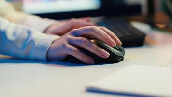 Extreme close up shot of editor selecting key frames to use while doing montage, working from home on computer. Woman using mouse to edit movie project footage in studio, camera A video